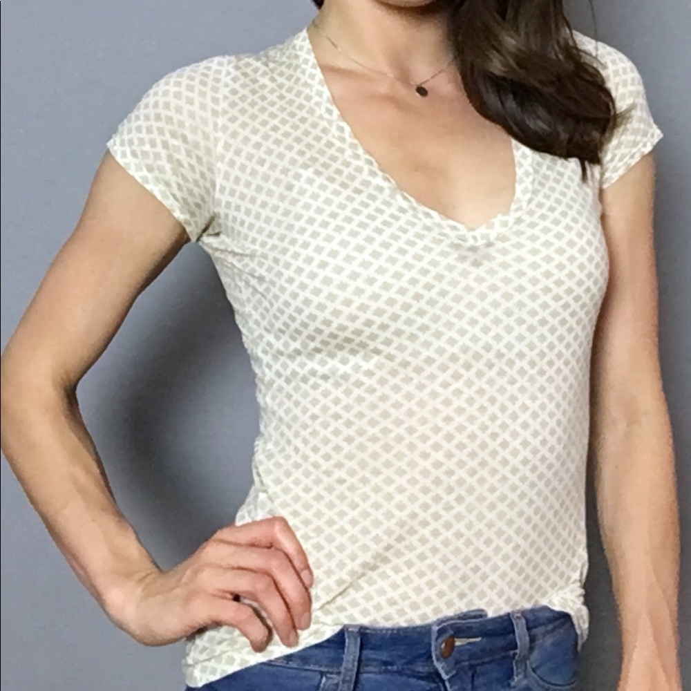 SOLD — White / Beige print v-neck top.